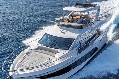 Luxurious 2023 Absolute Fly Co Ownership yacht cruising on open water.