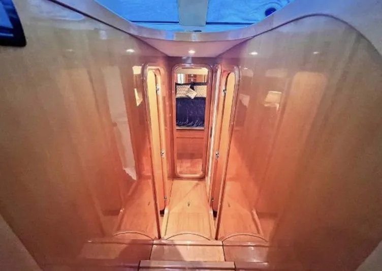 Blue Martini Yacht Photos Pics Interior of 2001 Uniesse Flybridge 48 yacht with polished wood finish.