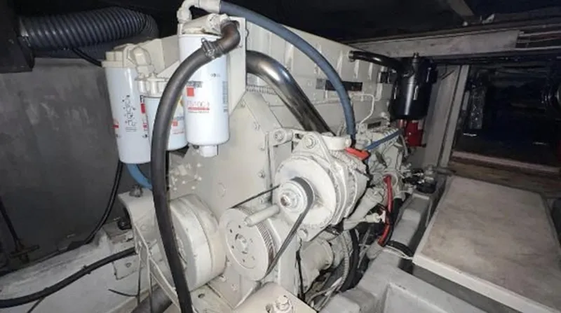 Blue Martini Yacht Photos Pics Engine compartment of a 2001 Uniesse Flybridge 48 yacht, showcasing mechanical components.