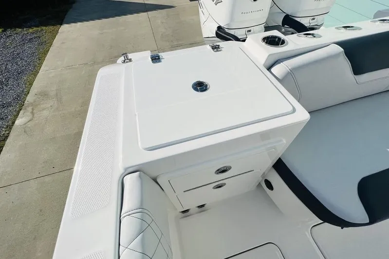  Yacht Photos Pics 2023 Fountain 32 NX boat interior with seating and storage compartments.