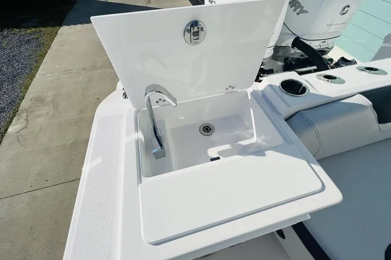  Yacht Photos Pics 2023 Fountain 32 NX boat sink with faucet, featuring a sleek white design.