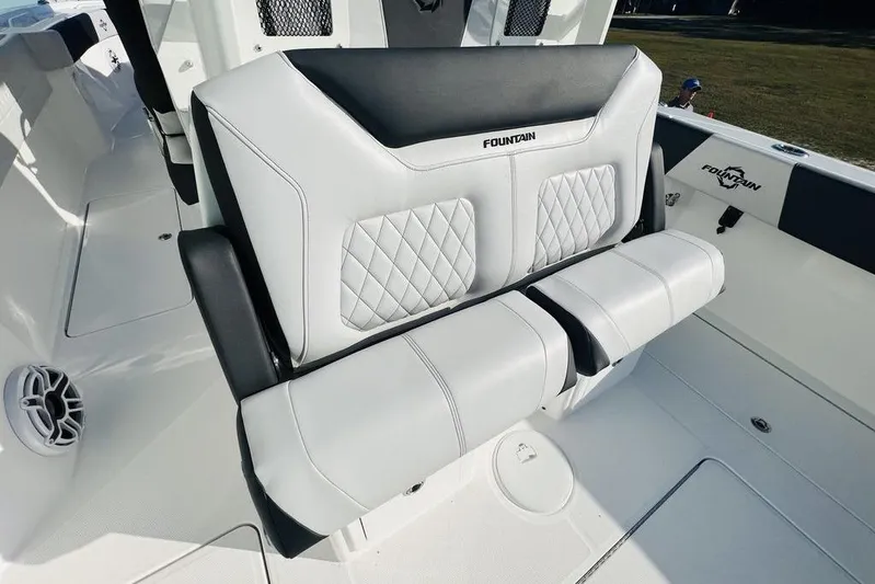 Yacht Photos Pics 2023 Fountain 32 NX boat interior with luxurious white seating and diamond stitching.
