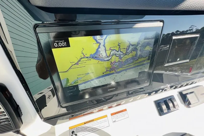  Yacht Photos Pics Garmin navigation display on 2023 Fountain 32 NX boat dashboard.