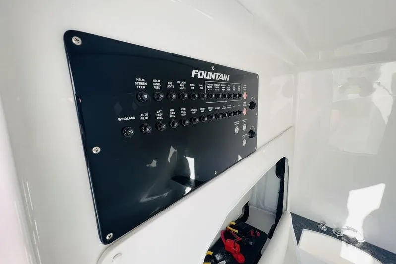  Yacht Photos Pics Control panel of 2023 Fountain 32 NX boat, featuring various switches and indicators.