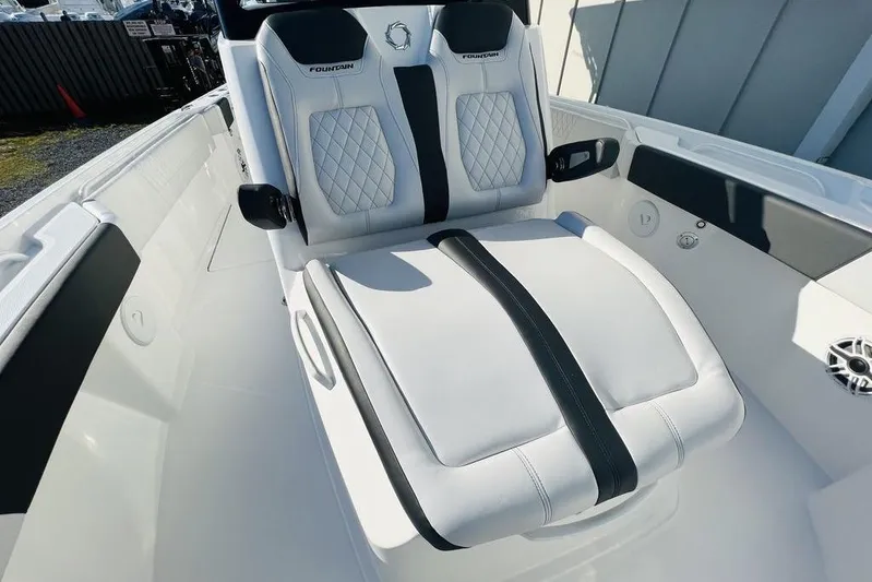  Yacht Photos Pics 2023 Fountain 32 NX boat interior with luxurious white seating and modern design.