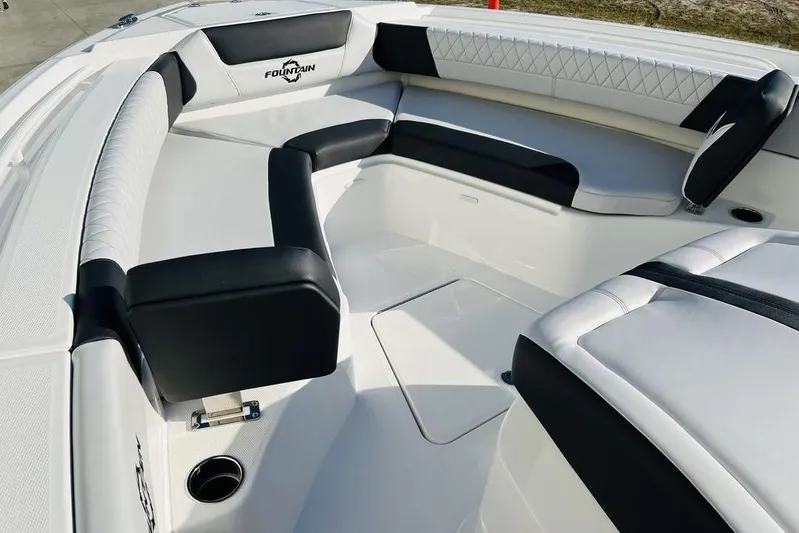  Yacht Photos Pics 2023 Fountain 32 NX boat interior with luxurious seating and sleek design.