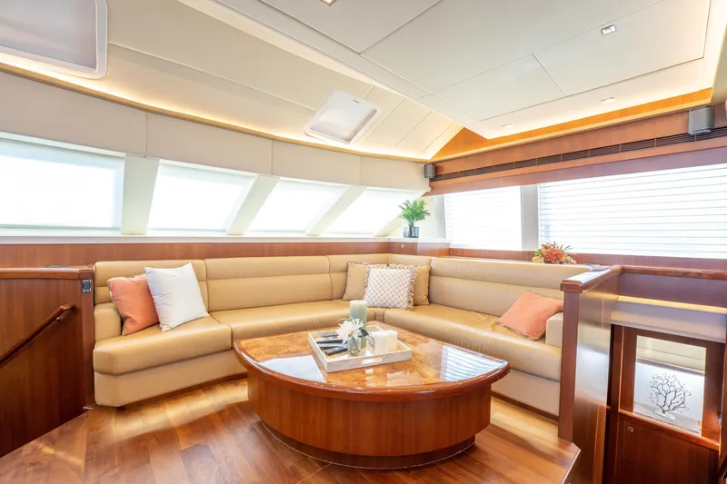 Island Girl Yacht Photos Pics Luxurious interior of 2016 Horizon PC52 yacht with elegant seating and decor.
