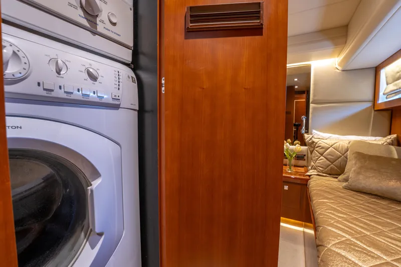 Island Girl Yacht Photos Pics Laundry area and cozy cabin interior of 2016 Horizon PC52 yacht.