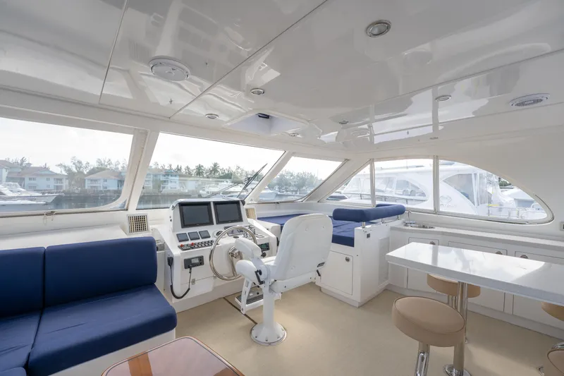 Island Girl Yacht Photos Pics Luxurious 2016 Horizon PC52 yacht interior with modern helm, seating, and panoramic windows.