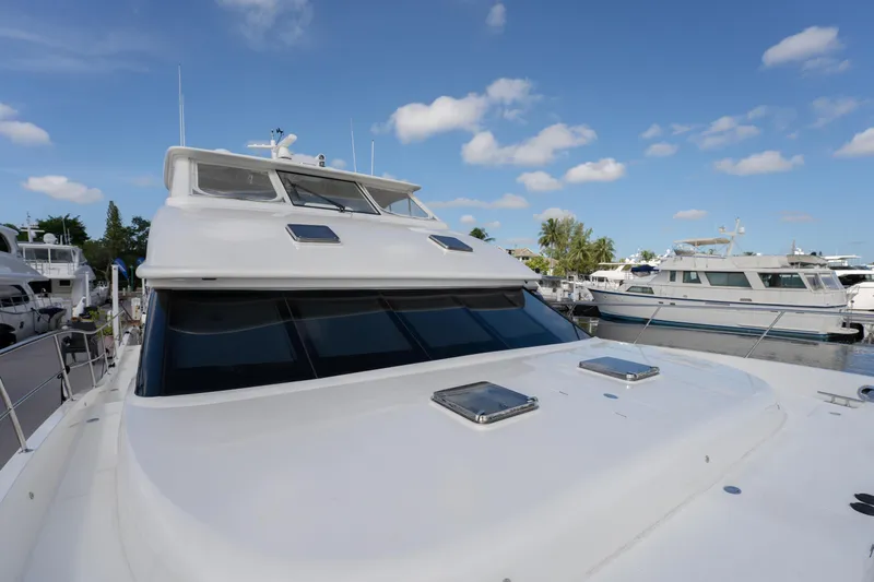 Island Girl Yacht Photos Pics Luxury Horizon PC52 yacht docked at marina under clear blue sky, 2016 model.