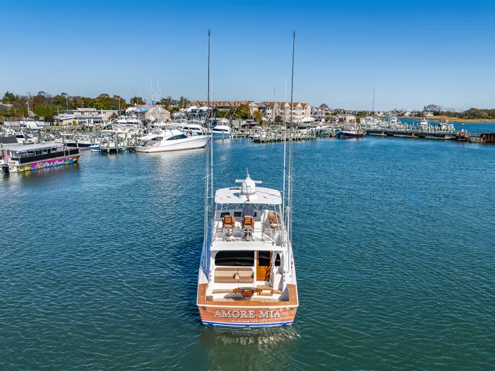 Amore Mia Yacht Photos Pics 2015 Viking 46 Convertible yacht "Amore Mia" docked in a scenic marina.