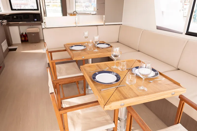 Tatani Yacht Photos Pics Luxurious dining area on 2021 Bali 4.8 yacht with elegant table settings.