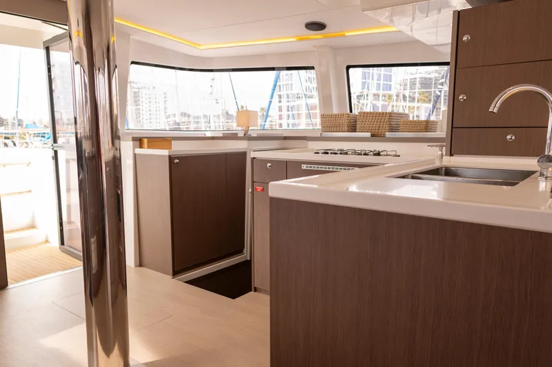 Tatani Yacht Photos Pics Modern kitchen interior on 2021 Bali 4.8 yacht, featuring sleek cabinetry and appliances.