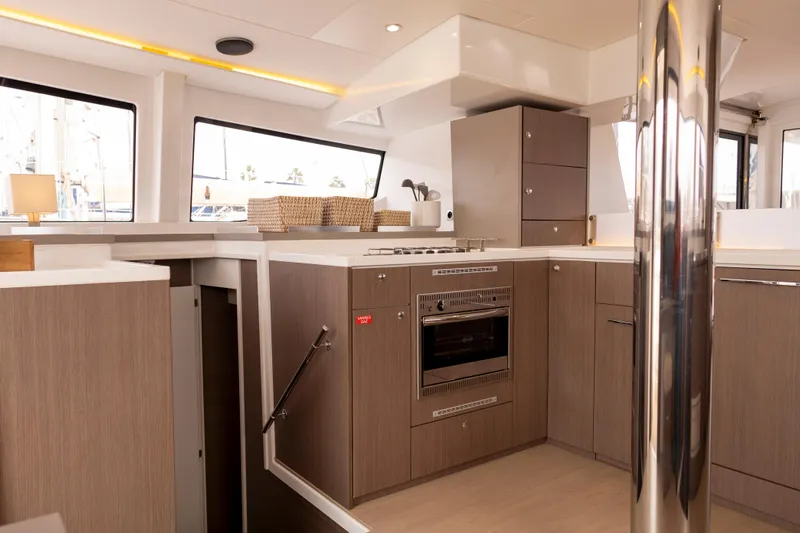 Tatani Yacht Photos Pics Modern kitchen interior on 2021 Bali 4.8 yacht, featuring sleek cabinetry and appliances.