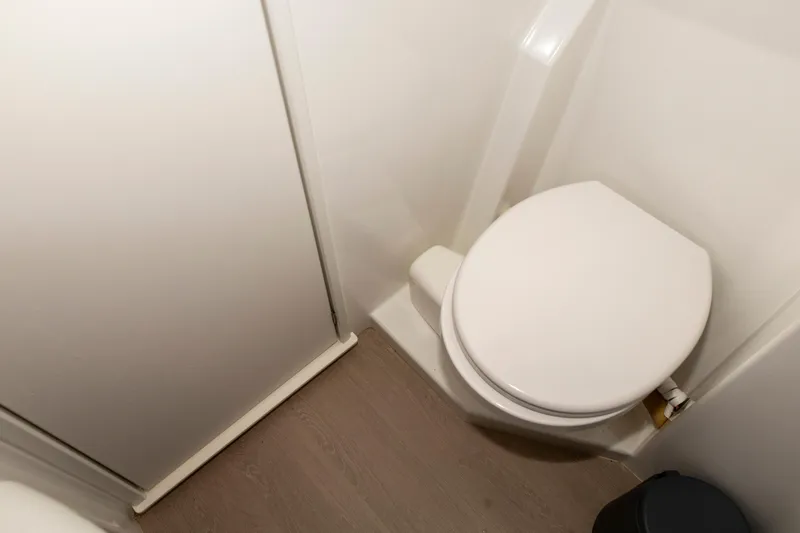 Tatani Yacht Photos Pics Compact bathroom in 2021 Bali 4.8 model, featuring a modern toilet and sleek design.