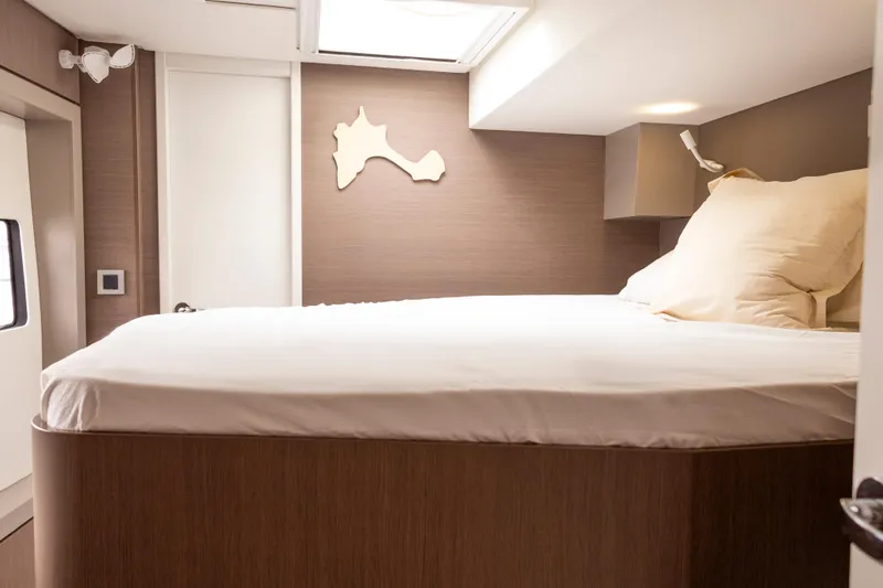 Tatani Yacht Photos Pics Interior of 2021 Bali 4.8 yacht cabin with bed and modern decor.