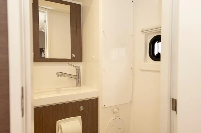 Tatani Yacht Photos Pics Modern bathroom interior on a 2021 Bali 4.8 yacht, featuring a sleek sink and mirror.