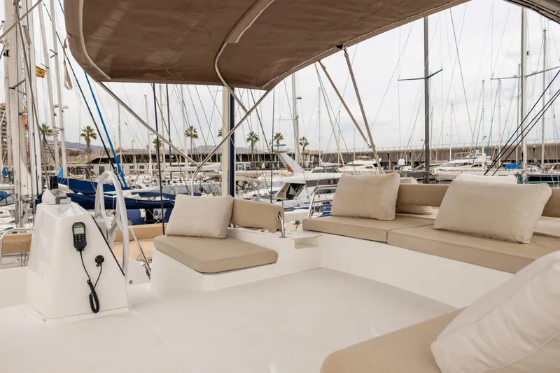 Tatani Yacht Photos Pics Luxurious Bali 4.8 catamaran deck with comfortable seating, docked in a marina, 2021 model.