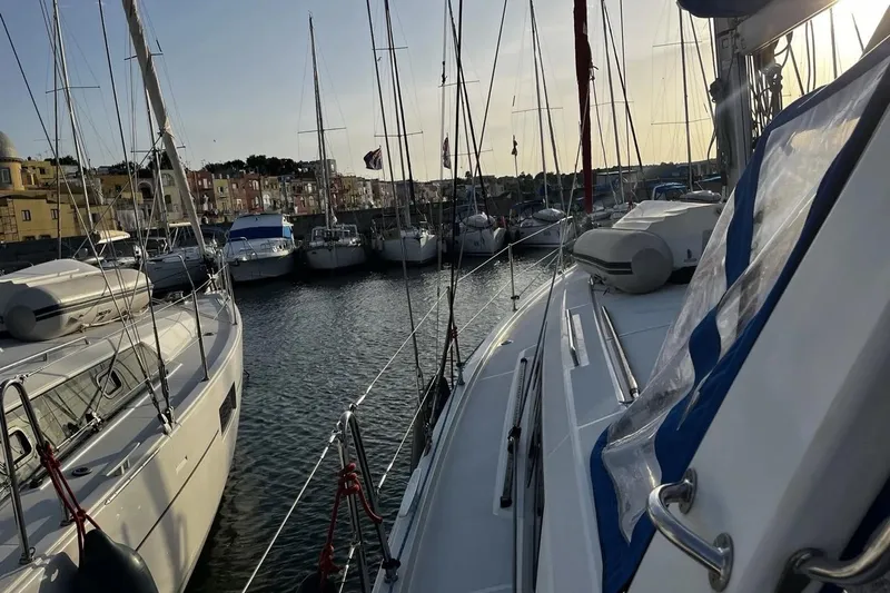  Yacht Photos Pics Beneteau Oceanis 41.1 sailboats docked in a marina at sunset, 2017 model.