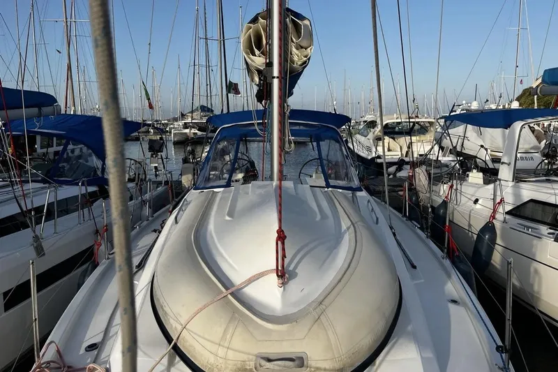  Yacht Photos Pics 2017 Beneteau Oceanis 41.1 sailboat docked in a marina, surrounded by other boats.