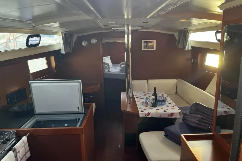  Yacht Photos Pics Interior of 2017 Beneteau Oceanis 41.1 yacht with cozy seating and dining area.
