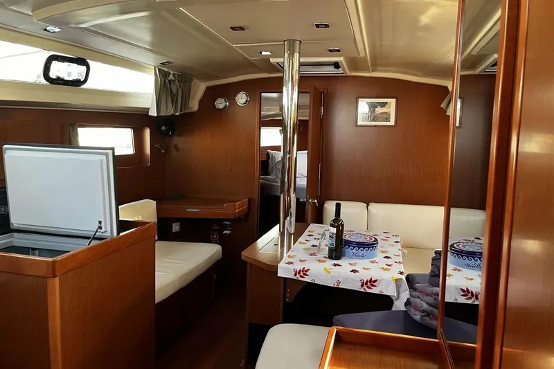  Yacht Photos Pics Interior of 2017 Beneteau Oceanis 41.1 yacht with cozy seating and dining area.