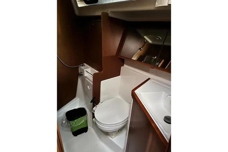  Yacht Photos Pics 2017 Beneteau Oceanis 41.1 yacht bathroom with toilet, sink, and mirror.