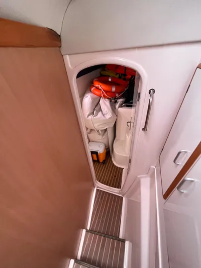 Una Vida Yacht Photos Pics Storage compartment on 2004 Leopard 47 yacht, containing life jackets and equipment.