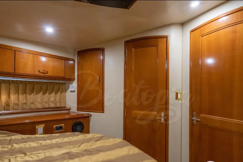  Yacht Photos Pics Luxurious interior of 2004 Carver 420 Mariner yacht with wood finish and cozy lighting.