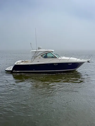 Alipa Yacht Photos Pics 2013 Tiara Yachts 3100 Open on calm water, side view.