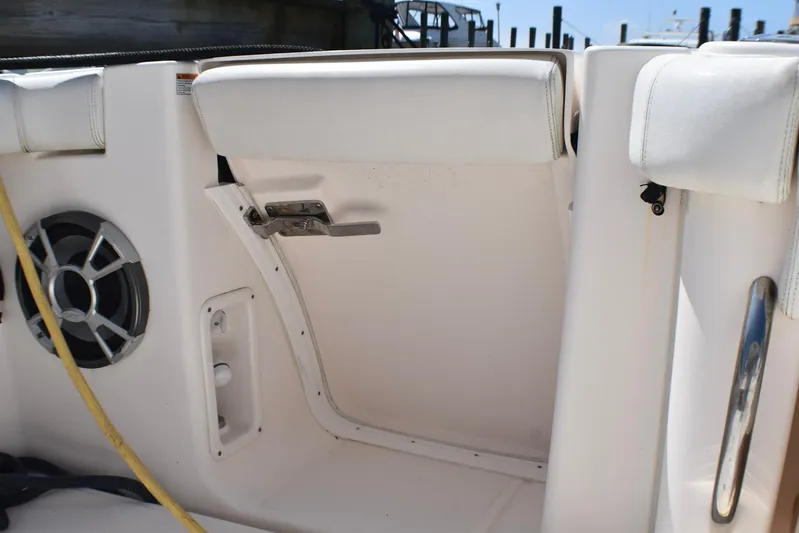 Alipa Yacht Photos Pics 2013 Tiara Yachts 3100 Open interior with speaker and cushioned seating.