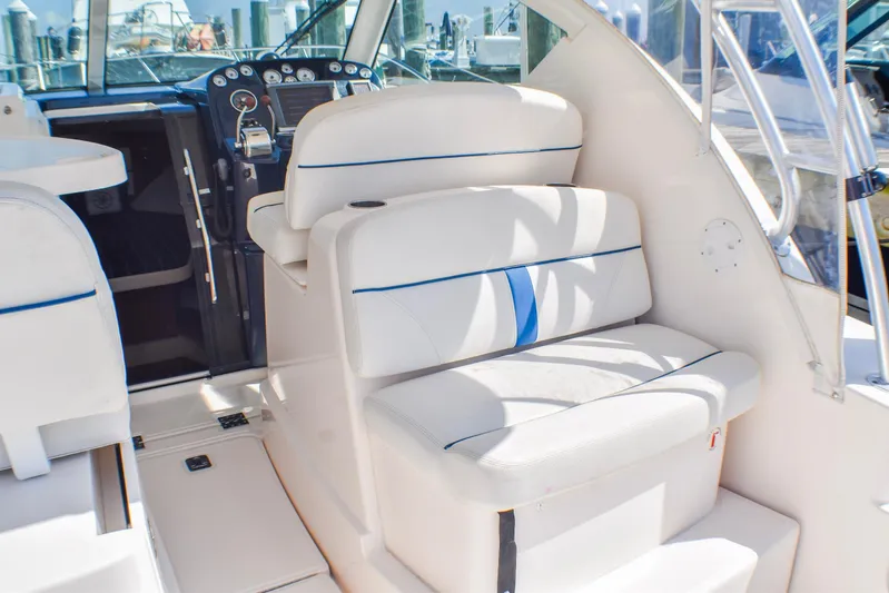 Alipa Yacht Photos Pics 2013 Tiara Yachts 3100 Open interior with white seating and control panel.