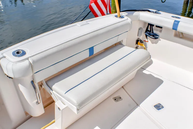 Alipa Yacht Photos Pics 2013 Tiara Yachts 3100 Open boat interior with white seating and American flag.