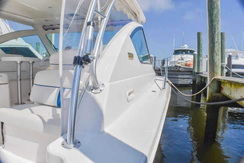 Alipa Yacht Photos Pics 2013 Tiara Yachts 3100 Open docked, showcasing sleek design and comfortable seating.