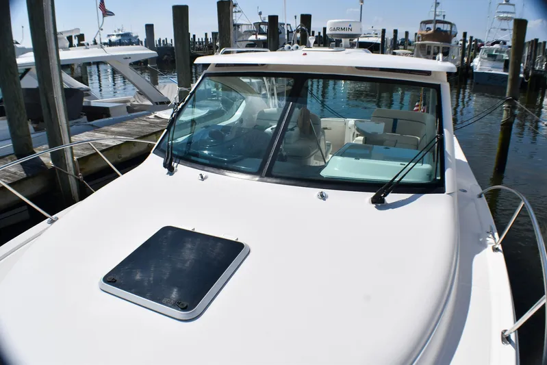 Alipa Yacht Photos Pics 2013 Tiara Yachts 3100 Open docked at marina, showcasing sleek design and spacious deck.