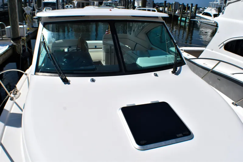 Alipa Yacht Photos Pics 2013 Tiara Yachts 3100 Open docked, showcasing sleek design and spacious cockpit.