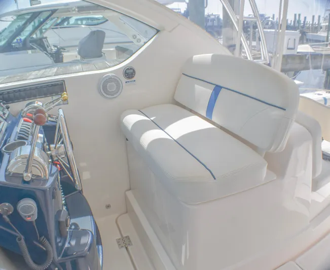 Alipa Yacht Photos Pics 2013 Tiara Yachts 3100 Open interior with white seating and control panel.