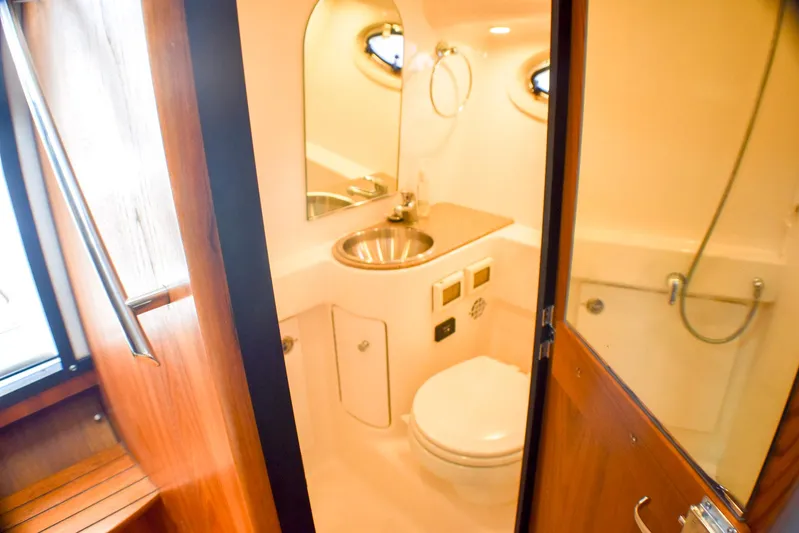 Alipa Yacht Photos Pics 2013 Tiara Yachts 3100 Open bathroom with sink, toilet, and shower.