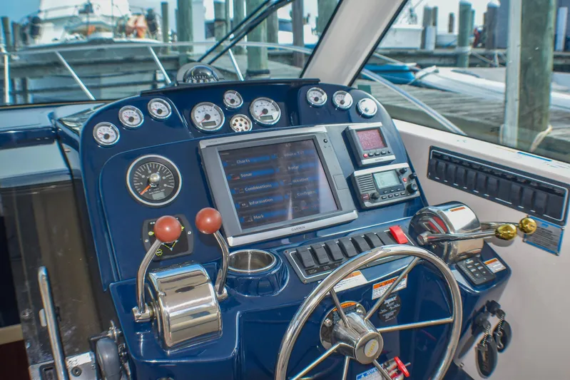 Alipa Yacht Photos Pics Control panel of a 2013 Tiara Yachts 3100 Open, featuring navigation and control instruments.