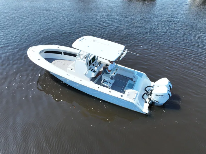 Motivated Yacht Photos Pics 2023 Front Runner 26 Center Console boat on calm water, aerial view.