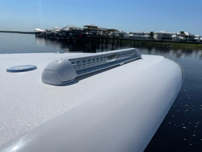 Motivated Yacht Photos Pics 2023 Front Runner 26 Center Console boat detail with LED light, dockside view.