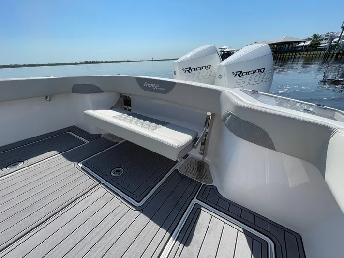 Motivated Yacht Photos Pics 2023 Front Runner 26 Center Console boat with dual Racing engines on calm water.