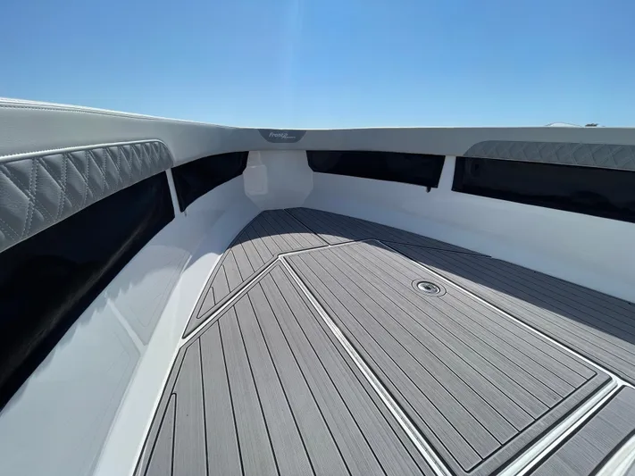 Motivated Yacht Photos Pics 2023 Front Runner 26 Center Console boat interior with sleek deck design.