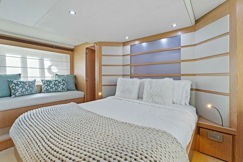 Big Deck Energy Yacht Photos Pics Luxurious bedroom interior of 2013 Ferretti Yachts 620 with modern design and cozy bedding.