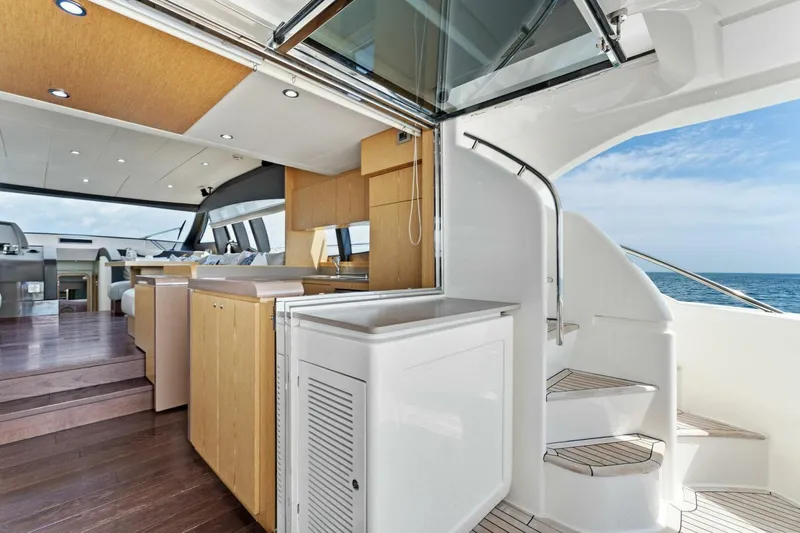 Big Deck Energy Yacht Photos Pics Luxurious interior of 2013 Ferretti Yachts 620 with modern kitchen and ocean view.