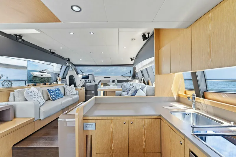 Big Deck Energy Yacht Photos Pics Luxurious interior of 2013 Ferretti Yachts 620 with modern kitchen and seating area.