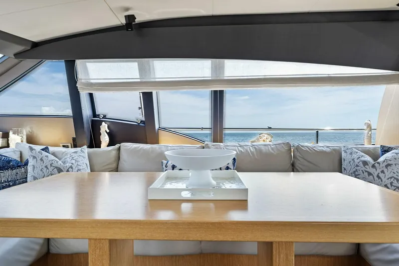 Big Deck Energy Yacht Photos Pics Luxurious interior of 2013 Ferretti Yachts 620 with ocean view through large windows.