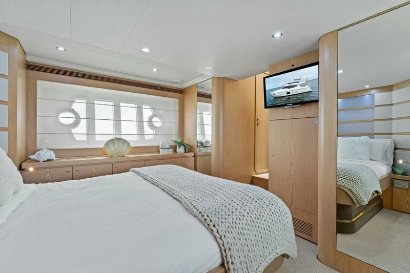Big Deck Energy Yacht Photos Pics Luxurious bedroom interior of 2013 Ferretti Yachts 620, featuring elegant decor and modern amenities.