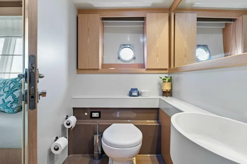 Big Deck Energy Yacht Photos Pics Luxurious bathroom in 2013 Ferretti Yachts 620, featuring modern fixtures and elegant design.