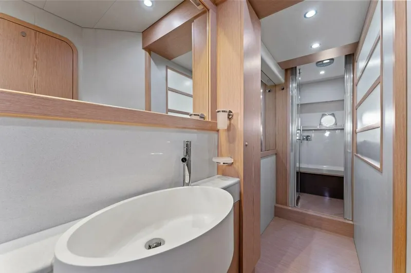 Big Deck Energy Yacht Photos Pics Luxurious bathroom interior of 2013 Ferretti Yachts 620 with modern fixtures and elegant design.